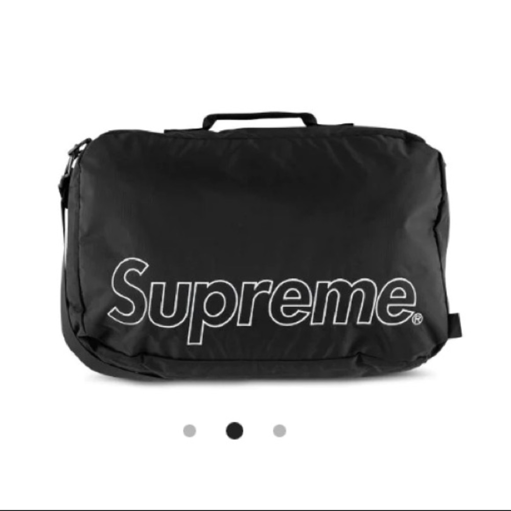 Supreme duffle bag black approximately 2 ft by 1 foot flat